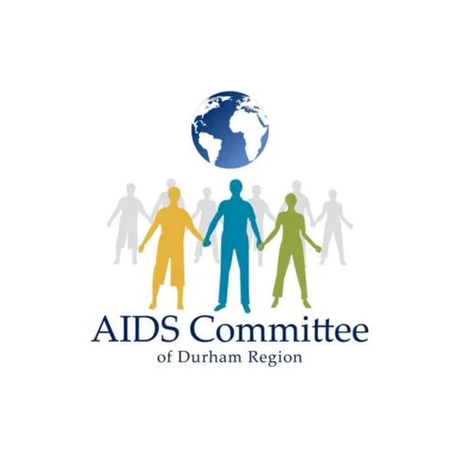 Logo of AIDS Committee of Durham Region with diverse figures holding hands and a globe above.